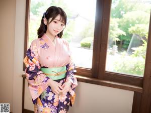 A woman in a kimono posing for the camera.