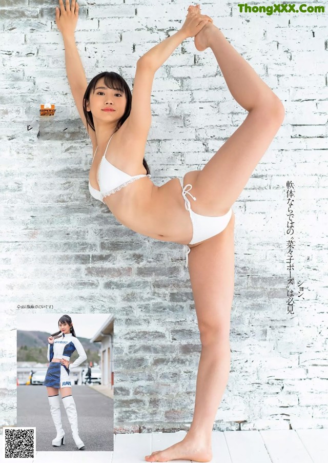 A woman in a white bikini doing a yoga pose.