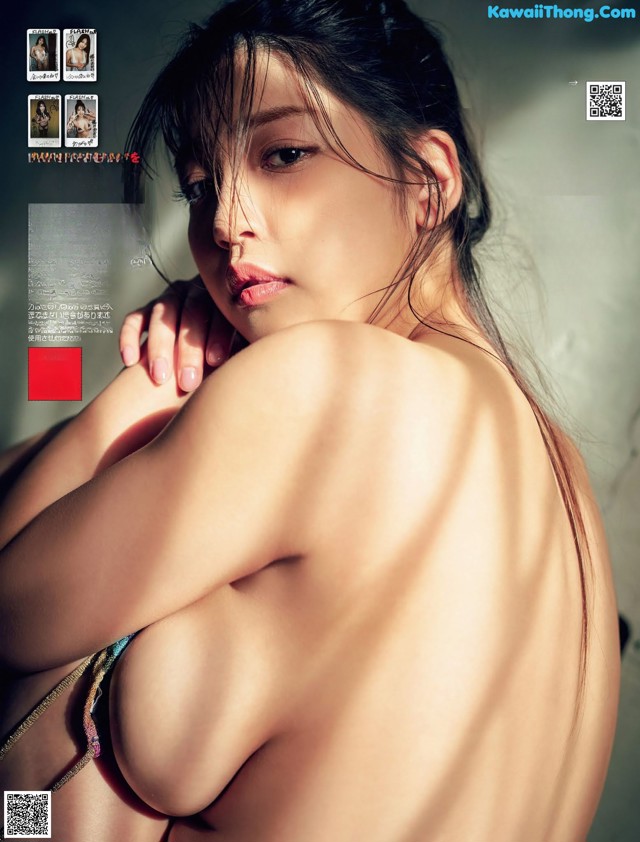 A naked asian woman in a bikini posing for a magazine.