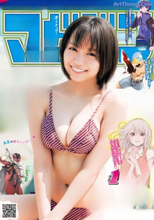 A woman in a bikini eating a cup of ice cream.