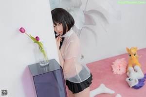 A woman in a white shirt and red panties posing for a picture.